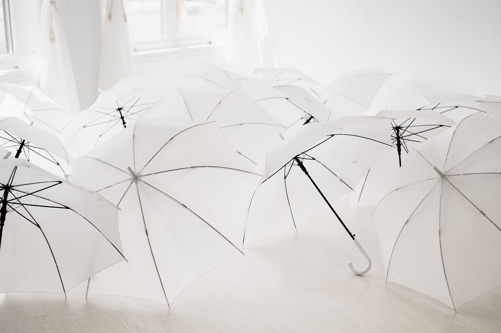 White Wedding Umbrellas keep you dry on your wedding day