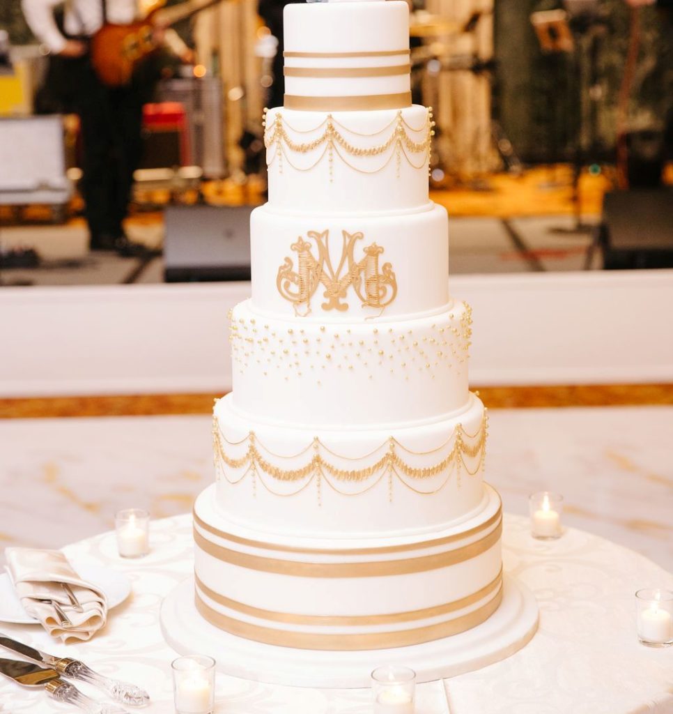 6 layer white and gold wedding cake with monogram at InterContinental Hotel Chicago