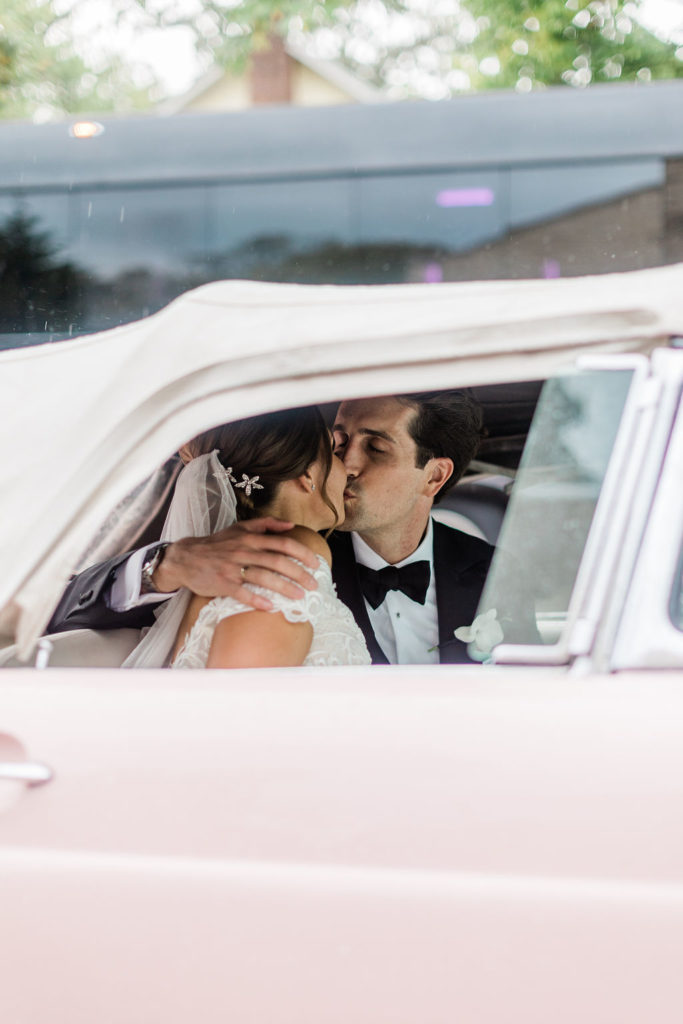 Bride and Groom Kissing in Pink Thunderbird