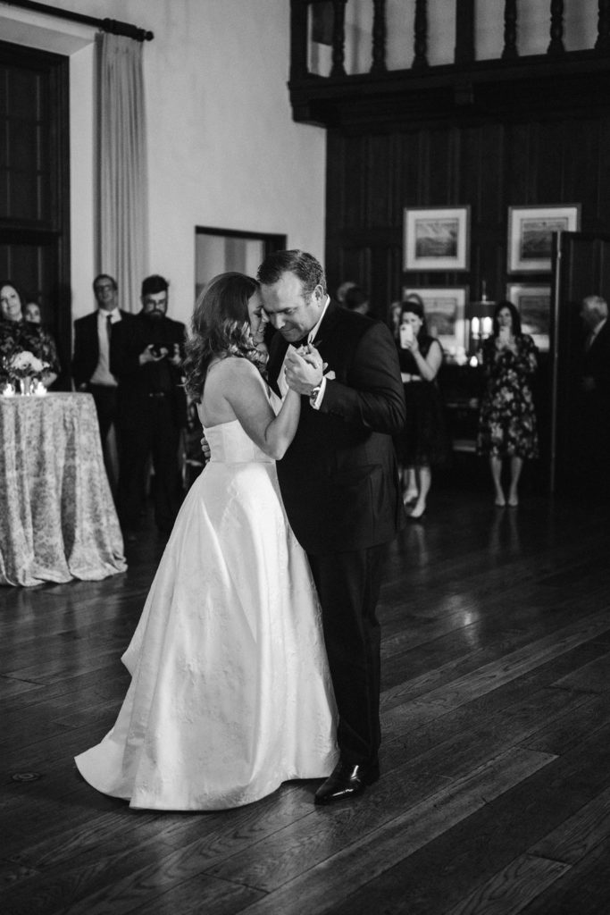 Bride and groom slow-dancing at wedding reception