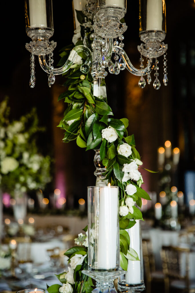 White and green florals on crystal candelabra
